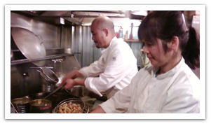 Solomon and his wife cooking.